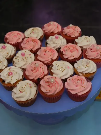 A duplicate image of the pink and white frosted cupcakes.