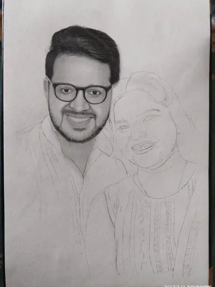 A work in progress shot of the couple's portrait, with the man's face shaded and the woman's still as a line drawing.