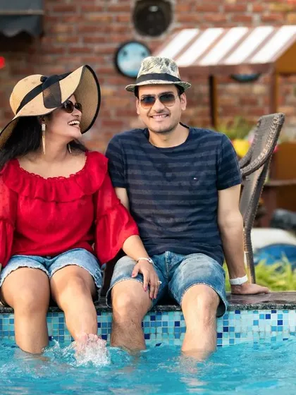 A relaxed, casual shot of Vishakha and Rahul dipping their feet in the pool. This shows how we can mix formal and informal styles in a single pre-wedding session.