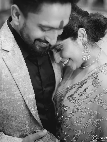 A soft, intimate black and white portrait of a couple sharing a hug. These are the moments that truly capture the soul of a relationship.