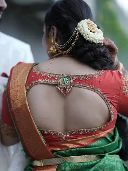 The full view of the blouse back, showing the personalized tassel as a central design element.