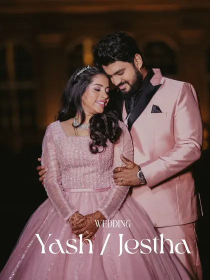 A romantic portrait of the couple in their reception outfits. The soft lighting and their close embrace create a dreamy and fairytale-like atmosphere.
