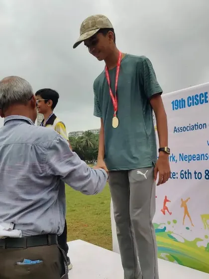 My athlete Deep Pilankar receiving his gold medal for the 3000m run at the ICSE/ISC Zonal Athletics Meet.