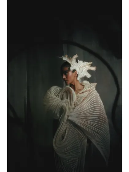 A dark and moody shot from the Vaishali S campaign. The low-key lighting creates a sense of mystery, drawing the viewer in to look closer at the garment's form.