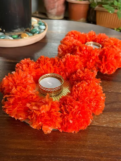 This festive season, quick-fix your home decor with these elegant marigold-themed diyas. They add a traditional and warm touch to any celebration.