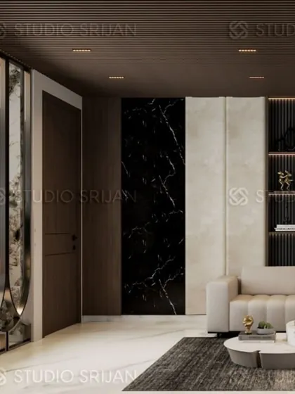 A detail shot from the Krishna Park living room, highlighting the use of different wall textures, including black marble and upholstered panels, to add depth and interest.