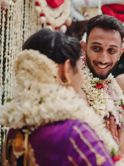 A groom's happy glance at his bride during the ceremony. Capturing these small, genuine interactions is what makes a wedding story complete.