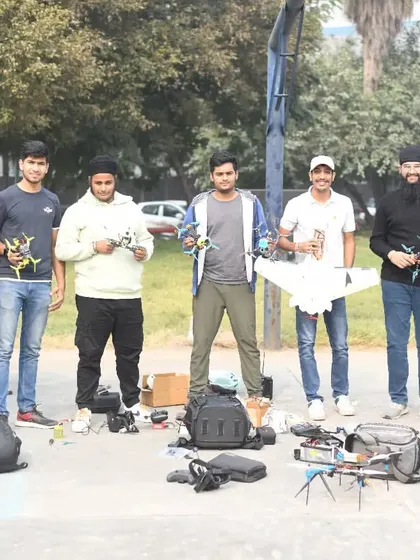 This is not just a team, it is a family. A group photo with fellow pilots and students from our community, all holding the drones and planes we love to fly.