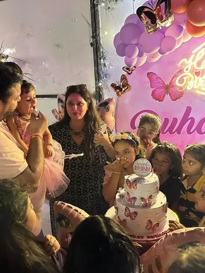A candid moment of the cake-cutting ceremony, surrounded by friends and family. My decor provides the perfect backdrop for these precious memories.