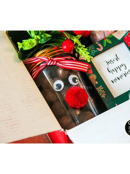A close-up of the adorable reindeer nutty jar from our 'Holly Jolly' Christmas hamper.