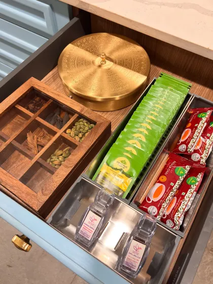 For a client who loves her tea time, we created a dedicated happy space. This drawer holds her favorite teas, spices, and a traditional masala box, all neatly organized and ready for her to enjoy a peaceful cup on her balcony.