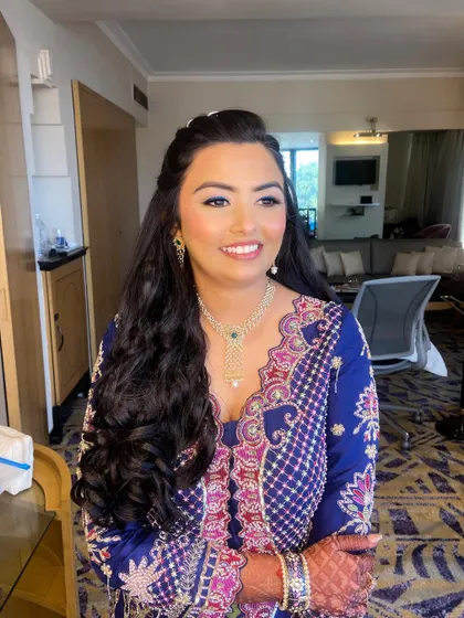 Bansi looks radiant and happy, with her makeup perfectly complementing her vibrant mehendi attire.