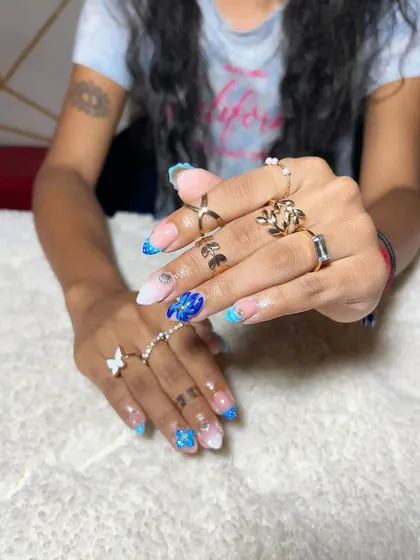 A vibrant blue and white set with glitter, foil, and butterfly accents. This shows how to mix different materials to create a dynamic and fun look.