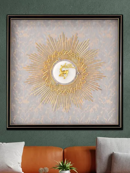 The Vibrant Ray shadow box features a central golden sunburst with a deer motif. The radiant design and textured background make it a captivating piece that adds energy to any room.