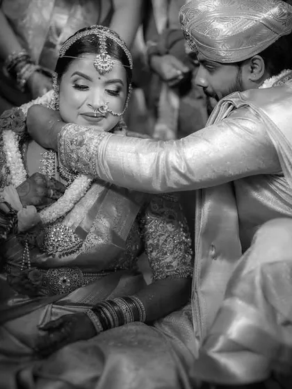 A black and white close-up of the Mangalyam ceremony. The tight framing and monochrome treatment add a sense of gravity and timelessness to this important ritual.