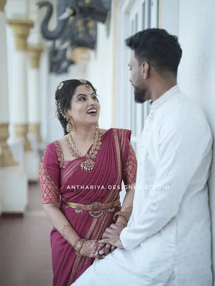 My client Anupa shares a happy moment with her partner during their engagement. She is wearing a beautiful Mysore silk saree with a custom-designed blouse.