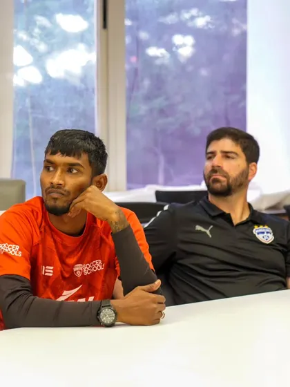 Coaches from our academy and elite teams listen intently during a strategy meeting. This ensures our player development pathway is seamless and effective from grassroots to the pro level.