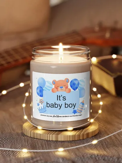 The "It's a baby boy" candle, beautifully lit and surrounded by fairy lights. It's a perfect way to announce the arrival of your little one.