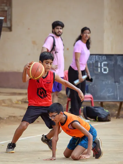 A young player from the U-11 division shows off his dribbling skills, navigating through the defense.