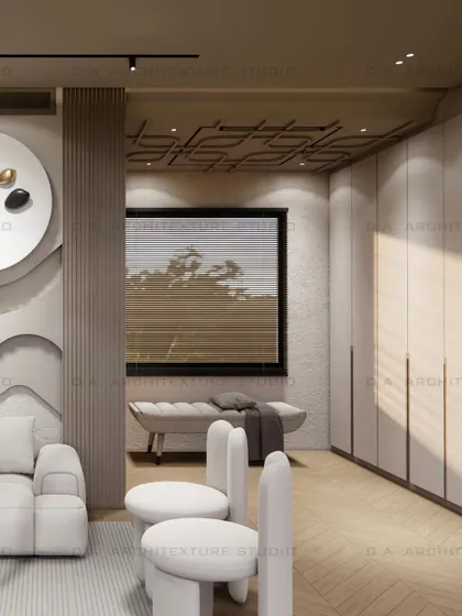 Another view of the day room, showing the seating area and the transition to the window-side bench, all tied together with a soft, neutral palette.