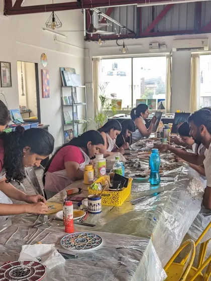 A busy workshop in session, with participants of all ages and backgrounds coming together to create.
