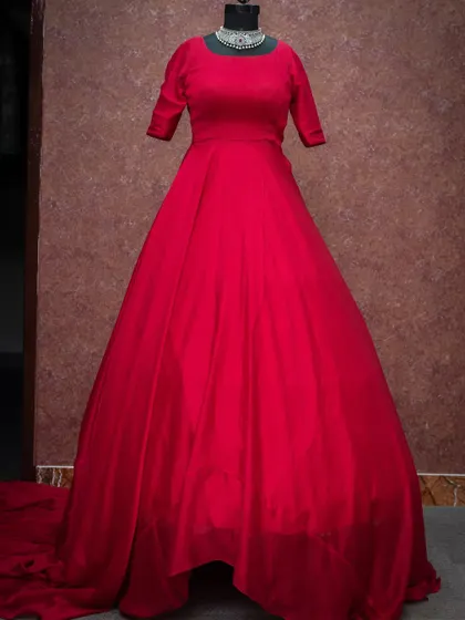 A vibrant red ball gown with a classic silhouette, perfect for making a bold statement.
