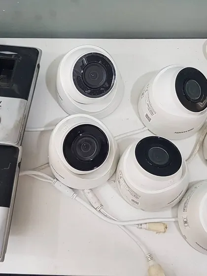 I also work with integrated systems. Here are Hikvision dome cameras alongside eSSL biometric scanners for a complete security and access control solution.