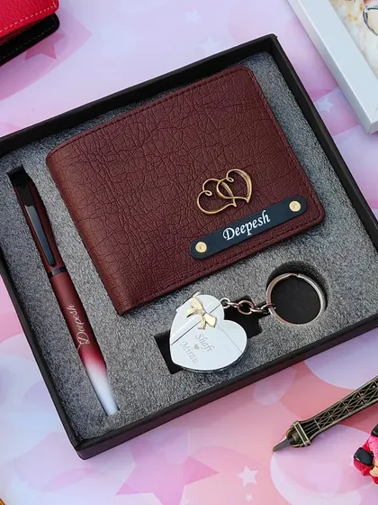 This combo features a high-quality leather wallet with a double heart charm, a personalized dual-shade pen, and a heart-shaped metal locket keychain that opens to reveal two photos.