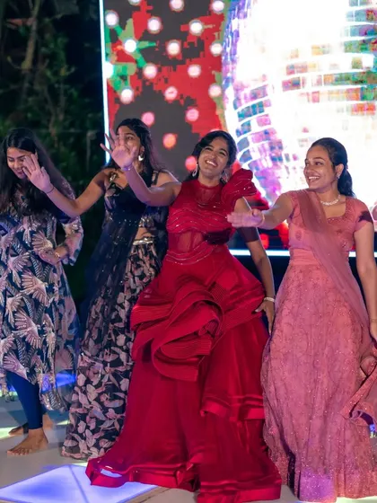 The bride leads her friends in a joyful dance number. We focus on creating a positive and encouraging atmosphere during rehearsals, so everyone feels confident and happy on stage.