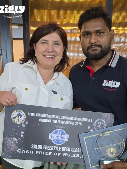 One of our groomers celebrating his 2nd place win in the Salon Freestyle Open Class. These accolades from international competitions highlight the professional skill we bring to every pet we groom.