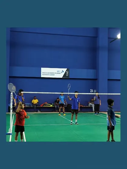 A doubles match in progress during a visit from players of Blue Caps Sports Arena. These interactions foster a sense of community and healthy competition.