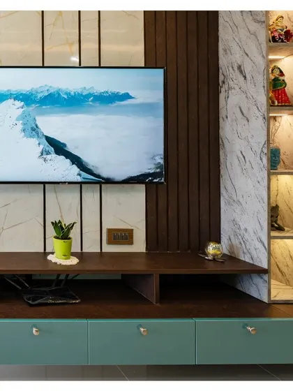 Level up your binge-watching game with this TV unit, where wooden panels cozy up to a marble backdrop and turquoise drawers add a dash of cheeky charm.