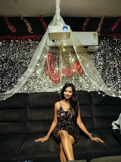 A guest sitting comfortably on our recliner, enjoying the ambiance of her party.