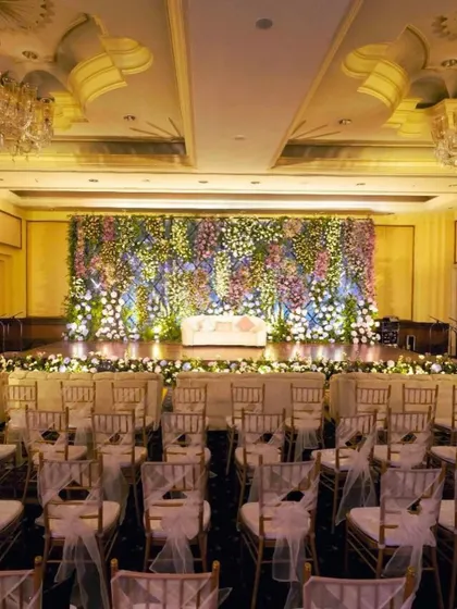 For this reception, we created a breathtaking backdrop with a wall of lavender and pastel florals. The strategic arrangement of hydrangeas, roses, and baby's breath created a magical and enchanting photo wall.