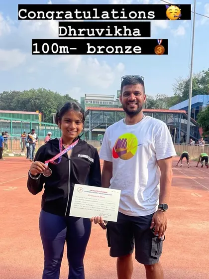 Dhruvikha proudly shows off her bronze medal for the 100m sprint at the Summer Athletic Meet.