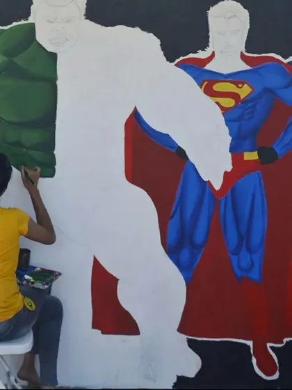 The process of bringing a hero to life. Here you can see the Hulk partially colored while Superman and Captain America are still in their outline phase.