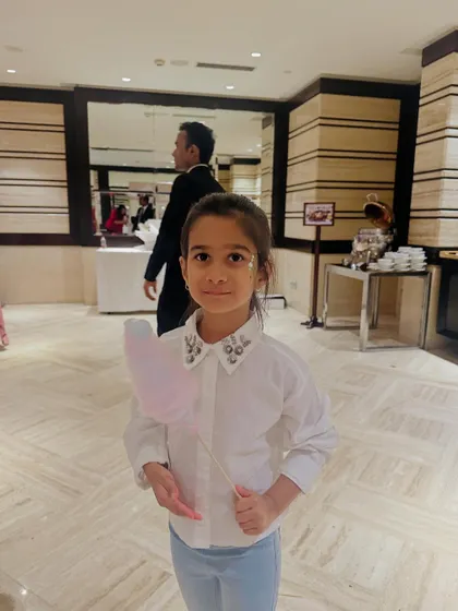A little guest looking sweet with her heart-shaped cotton candy. We can create fun shapes to match your party's theme.