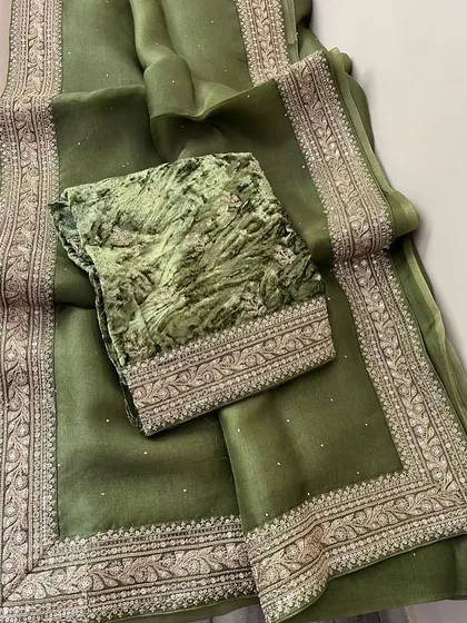A look at my Sabyasachi-inspired collection. These sets feature pure organza sarees with detailed borders, paired with luxurious velvet designer blouses. They are available in a range of beautiful colors like brown, navy, green, black, yellow, purple, and off-white.