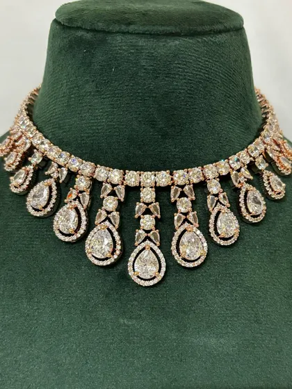 A close-up of a rose-gold plated American diamond choker. The warm finish makes this rental piece stand out.