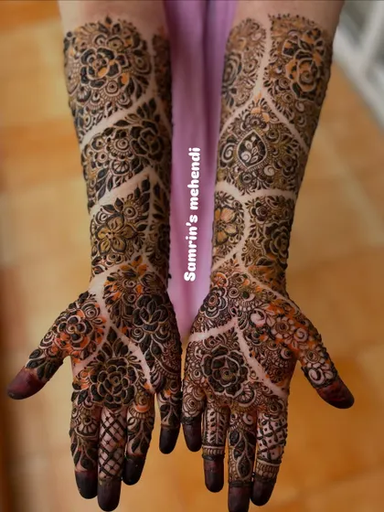 A unique designer pattern with a mix of floral and geometric elements. The use of negative space in a vine-like pattern on the arms is very striking.