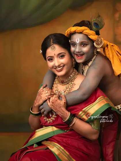 The bond between a mother and her child is divine. This portrait from our Krishna-themed shoot is a testament to that pure and unconditional love.
