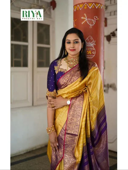 A full look at the traditional outfit I wore to a recent wedding. The rich yellow of the silk saree contrasts beautifully with the custom purple blouse. I love combining classic colors and intricate blouse designs to create a look that feels both traditional and personal.