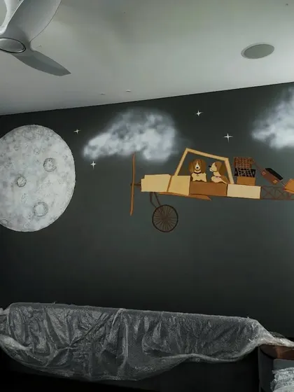 A full view of the kid's room installation during the final stages. This type of mixed-media wall art creates a magical, storybook atmosphere that a simple painting cannot achieve.