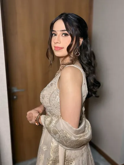 A side profile of this fresh and pretty morning engagement makeup. The soft curls and minimal jewelry complete the look perfectly.