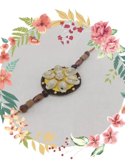 A unique rakhi made with cowrie shells and wooden beads. We use a mix of traditional and modern materials in our craft classes.