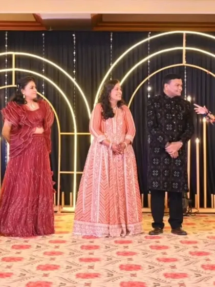 Organizing a group activity on stage to get all the family members involved. These moments of collective fun are what make a Sangeet truly special and bring both sides of the family together.