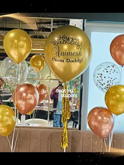 Make your message float with our custom printed balloons. This bouquet for a new dad features a personalized message on a large gold balloon, surrounded by coordinating chrome and confetti balloons.