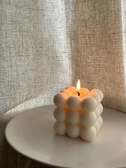 Cozy mood. Our classic bubble candle is perfect for a quiet evening with a book.