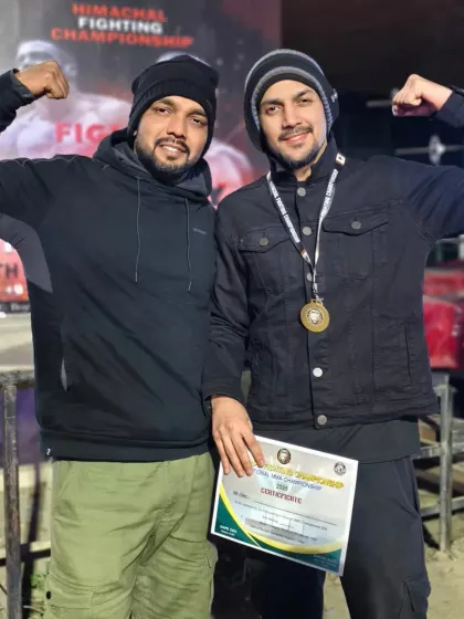 Team Jamshedkhan at the Himachal Fighting Championship. Posing with my student after he won his bout, certificate and medal in hand.