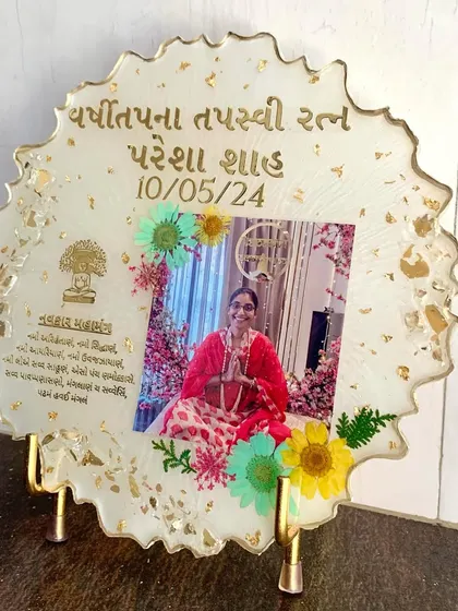 A memorial frame with a photo, mantra, and preserved flowers. A beautiful way to honor a loved one.